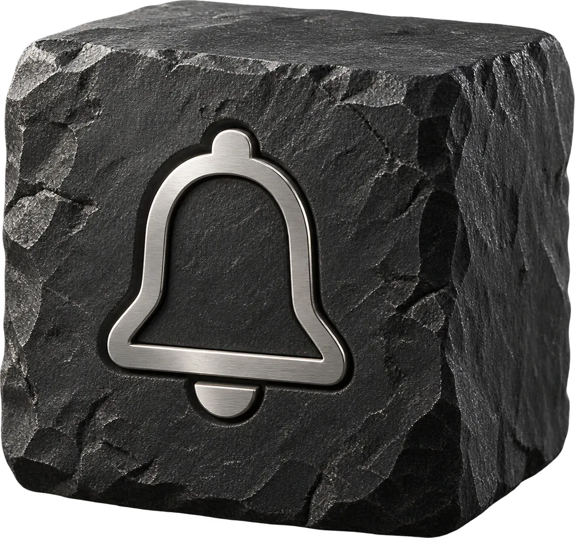 A steel bell icon set into a block of black stone